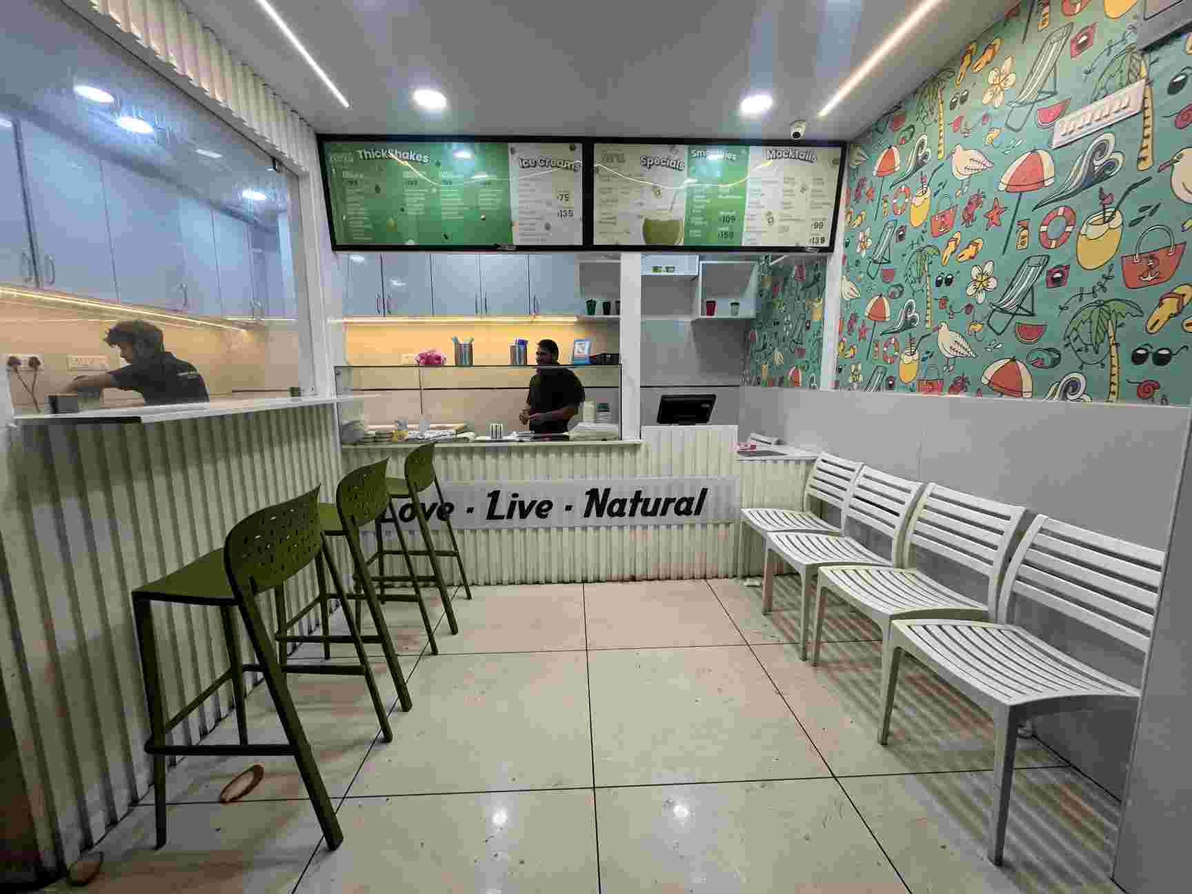 Coconut juice bar interior with Love Live Natural motto