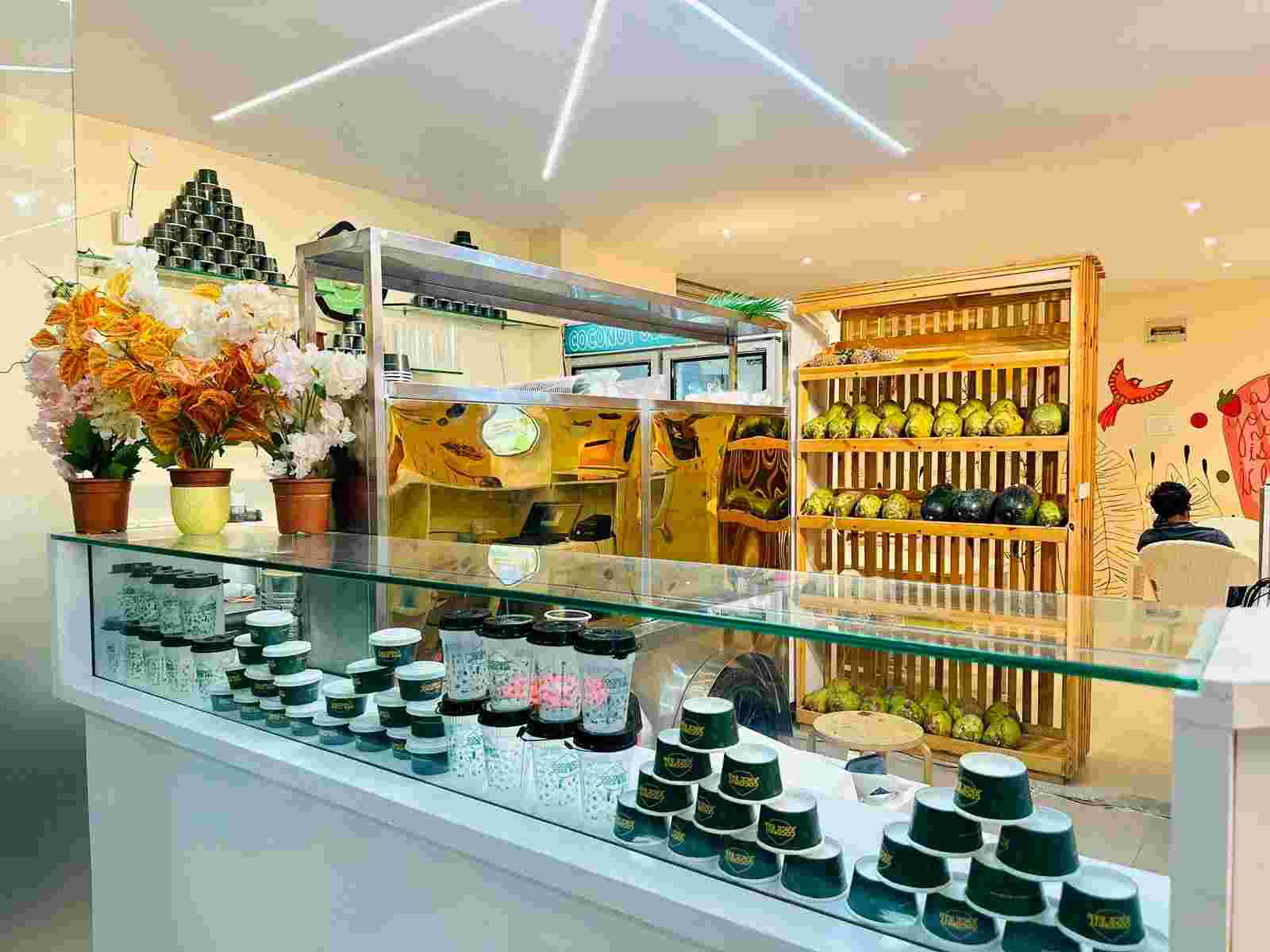 Fresh coconuts display and coconut juice bar products showcase